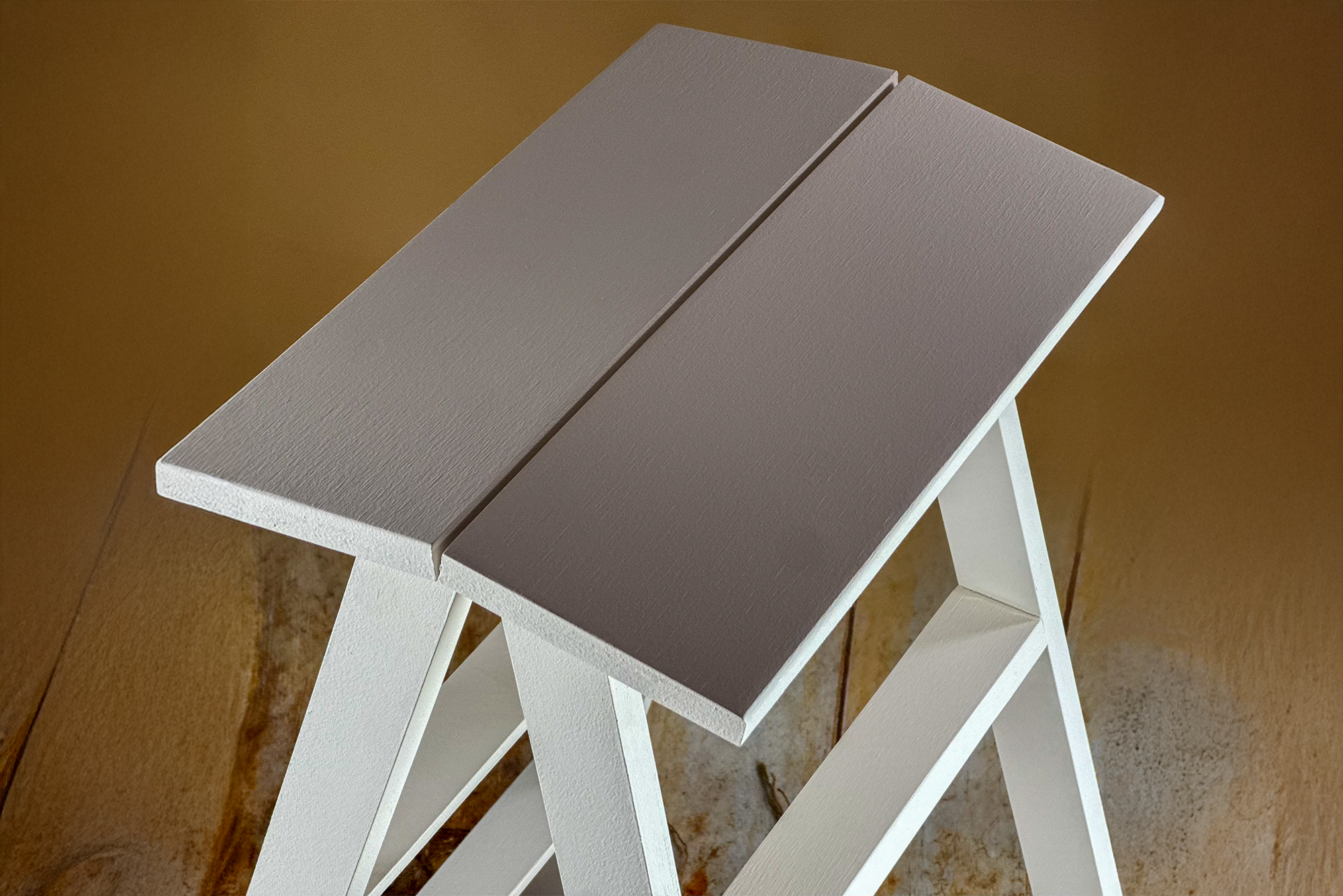 White wooden step ladder with a slatted top, used as a rustic newborn photography prop for posing setups.