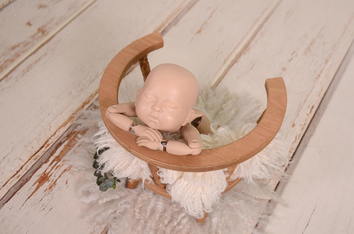 Newborn photography prop: Cozy round chair, perfect for sitters or baby portraits.