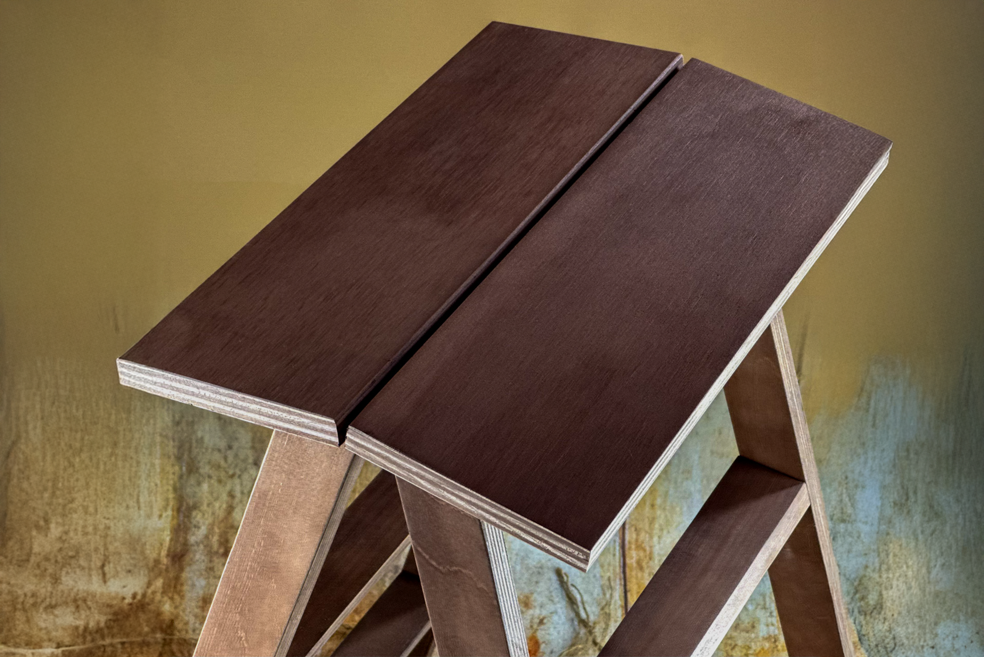 Close-up of dark brown wooden step ladder sitting area, a rustic newborn photography prop ideal for vintage studio themes.