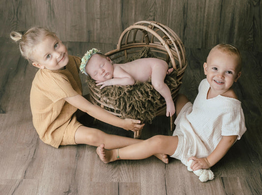 Mastering the Art of Sibling Newborn Photography with Boxes, Bowls, and Buckets