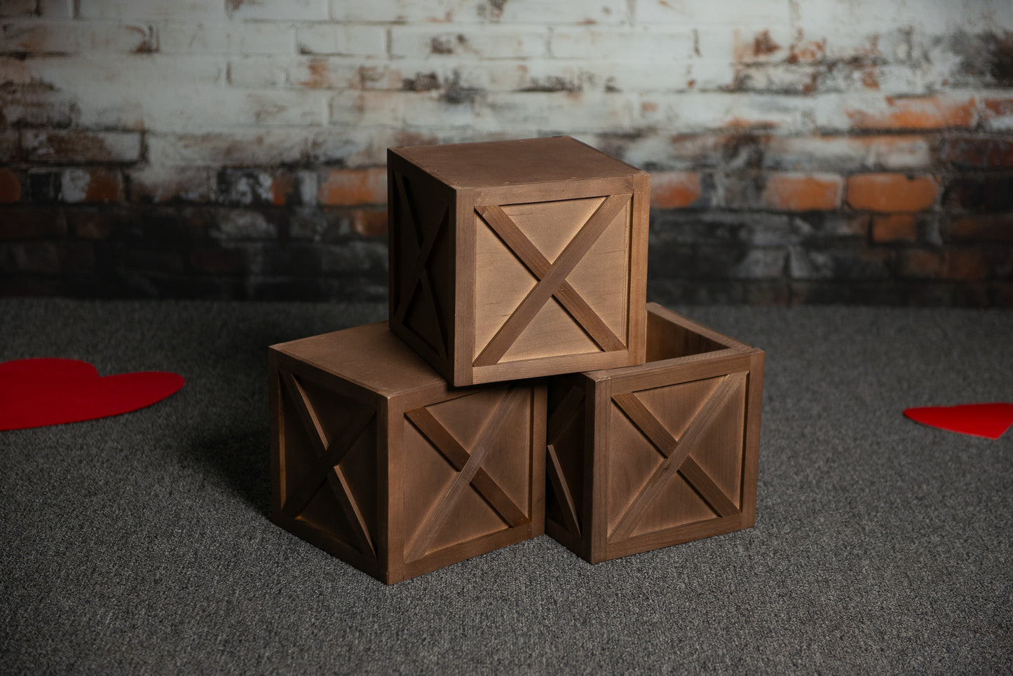 Rustic Walnut Prop Boxes
Charming brown wooden boxes with a classic X-panel design, perfect for adding a natural, warm touch to photography sessions.