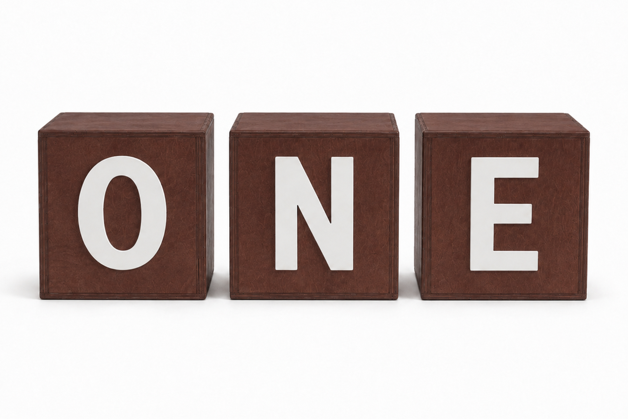 Three brown wooden blocks spelling the word ONE, with large white letters. Cake Smash Photography props
