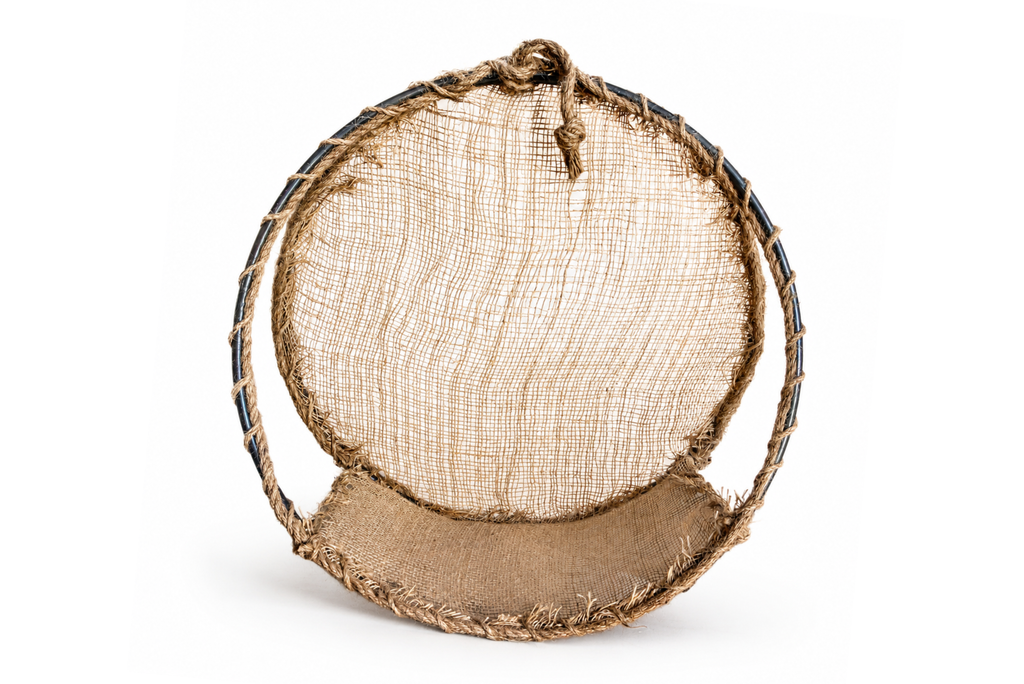 A circular woven basket Round Rustic Swing made from natural jute rope, burlap fabric, and metal frame. Newborn photography prop.