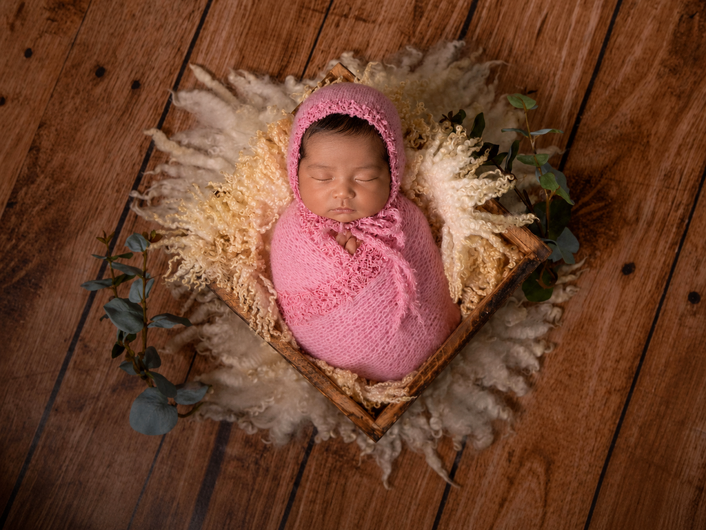 Newborn baby wrapped in pink fabric and bonnet, newborn photography clothing