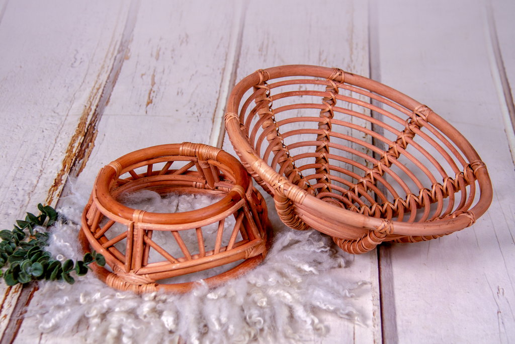 Disassembled rattan bowl papasan bed newborn photography prop shown with its base and top beside each other.