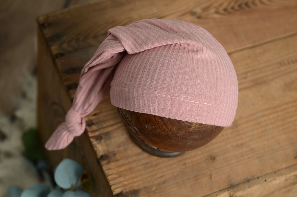 Pink ribbed beanie. Ribbed knot sleepy cap with a long knotted tail for newborn photography.