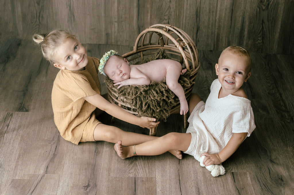 LullabyLuxe Rattan Bassinet - Chestnut Finish