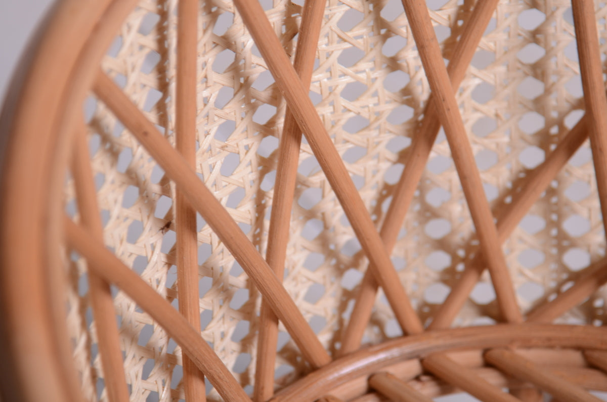 Close-up of the woven cane backrest on a rattan nest cocoon newborn photography prop, showcasing its delicate lattice pattern and fine craftsmanship.