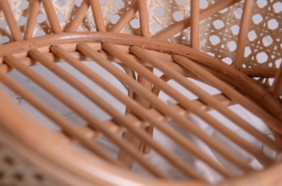 Close-up of the rattan slatted seat on the nest cocoon newborn photography prop, emphasizing the craftsmanship and sturdy yet delicate design.