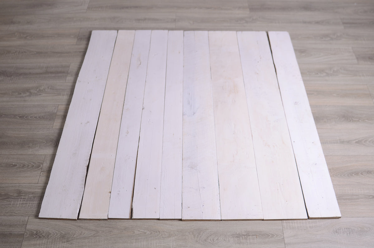 Rustic wooden floor backdrop with warm tones, ideal as a newborn photography prop for cozy setups.