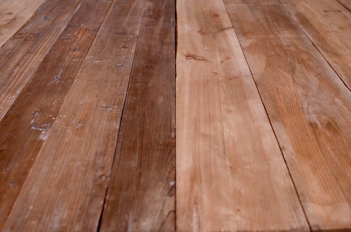 Newborn photography setup featuring a backdrop and floor set made from genuine reclaimed wood.