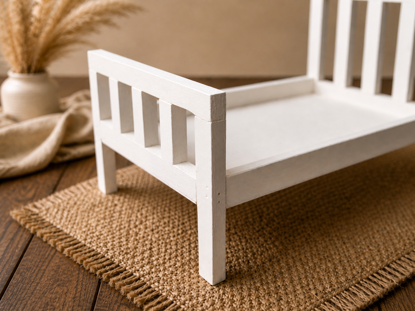 White wooden bed with headboard designed for newborn photography