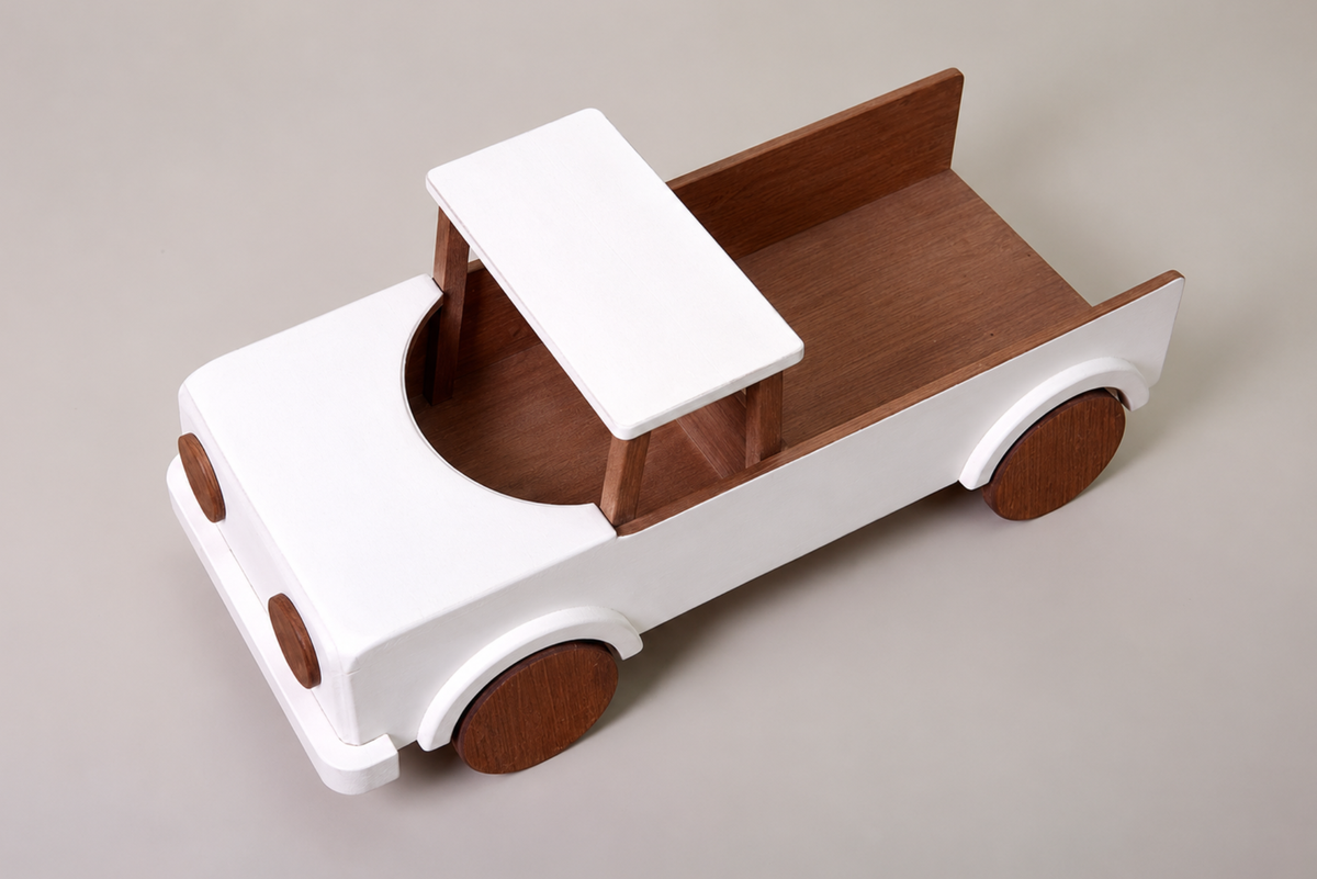 A wooden pickup truck with a white-painted body and natural brown wood accents, including the bed, wheel covers, and front bumpers, perfect for cake smash photography
