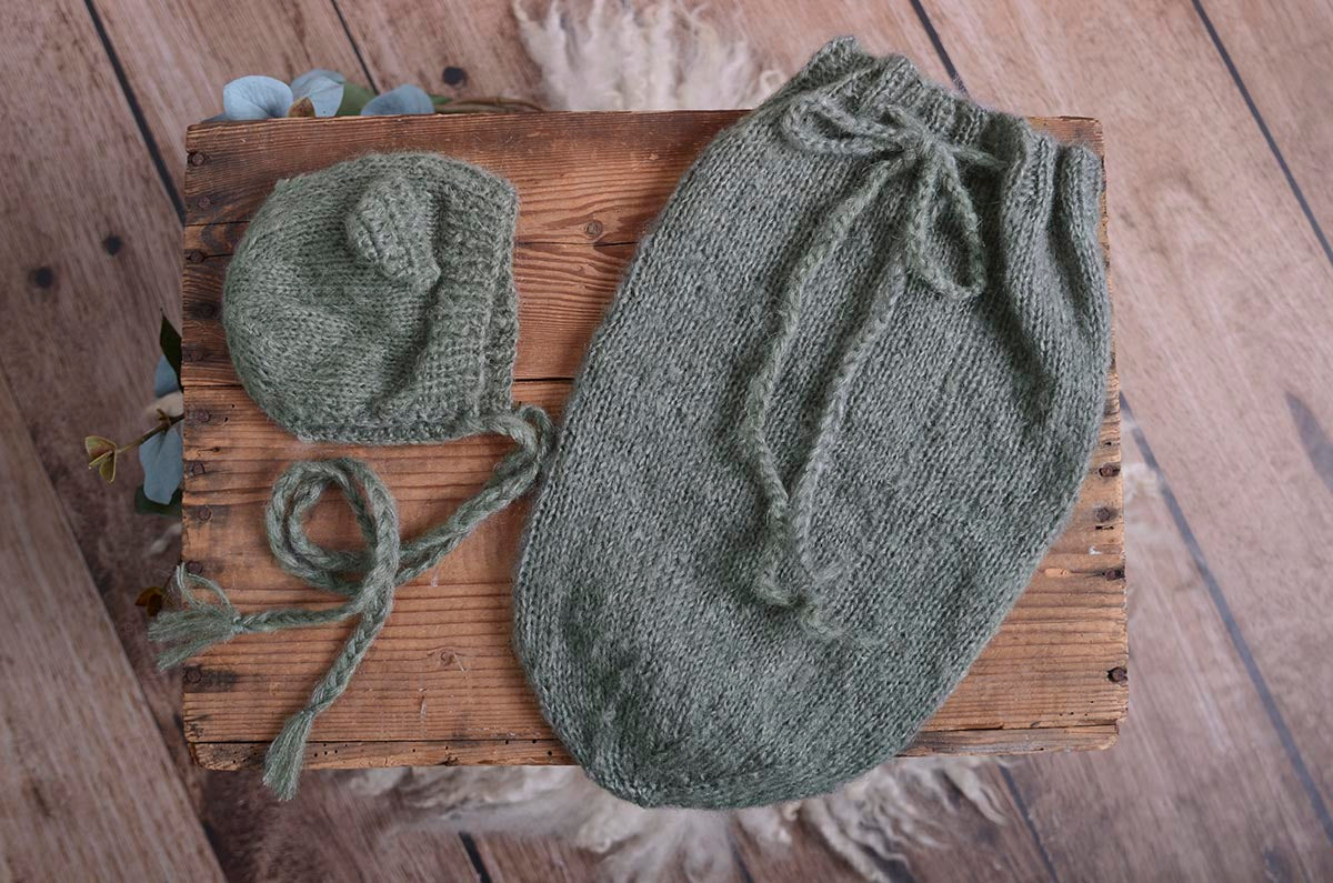 Display of beige mohair bear bonnet and matching sack on a rustic wooden crate, showcasing the newborn photography prop's texture and handmade quality.