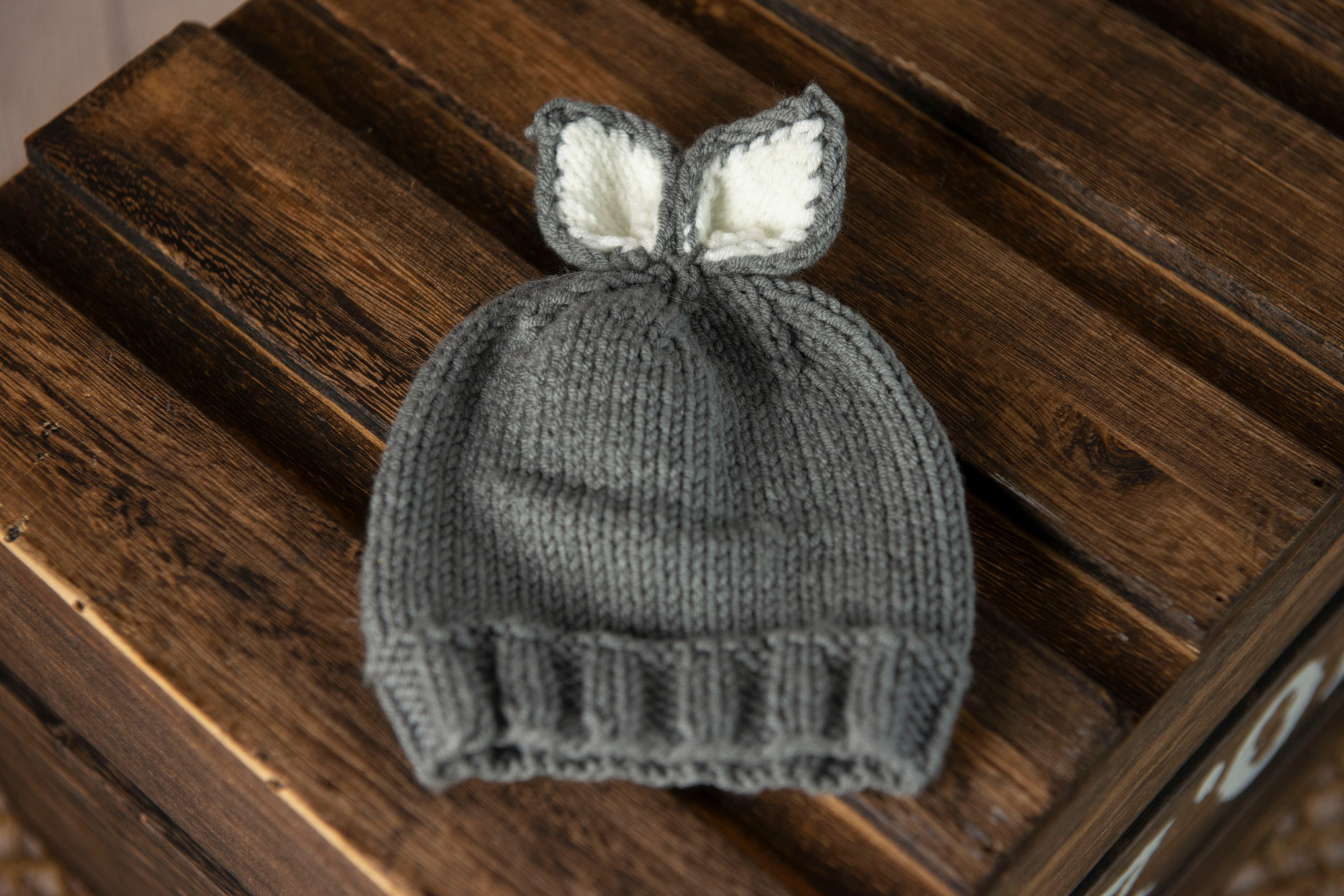Gray knit baby hat with white accents, bunny ears, newborn photography prop