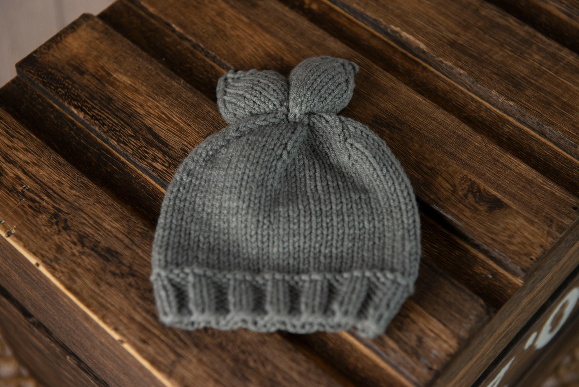 Gray knit baby hat with white accents, bunny ears, newborn photography prop