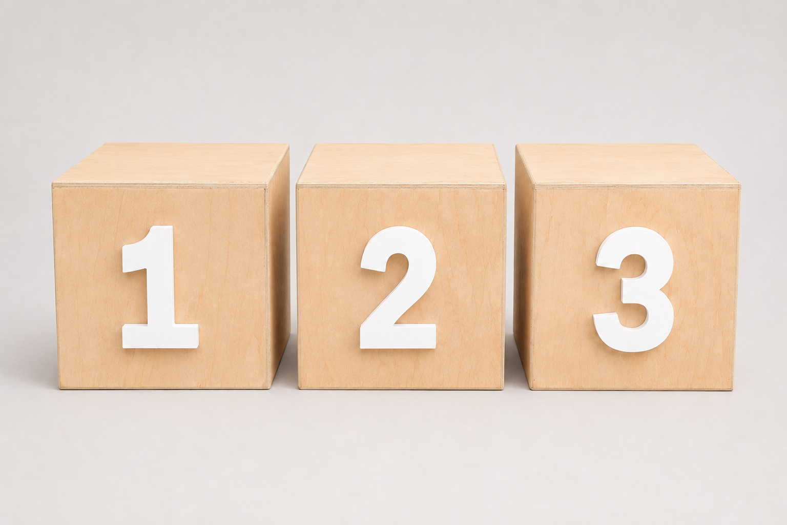 Three cake smash wood blocks arranged side by side, each displaying a large white number: 1, 2, and 3.