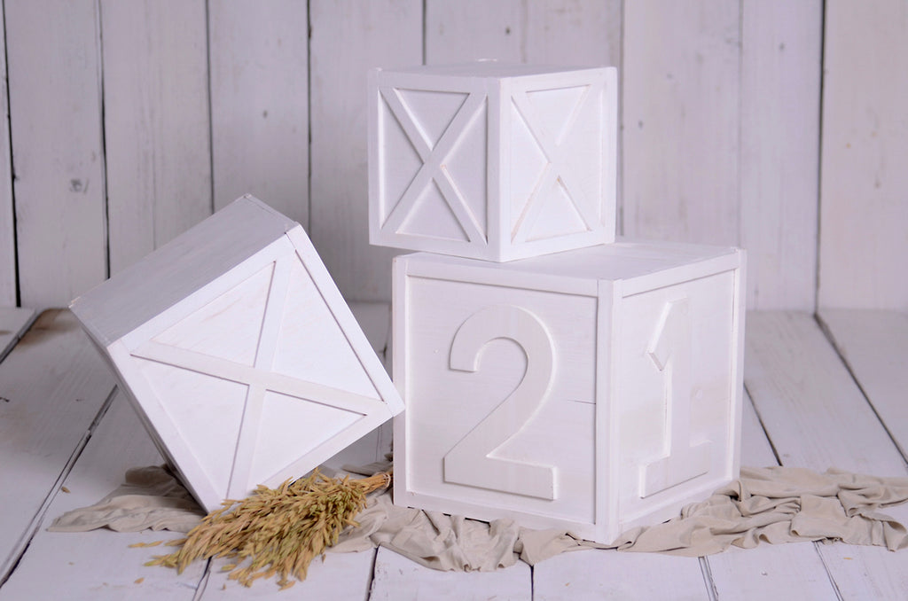 Stacked white crates with engraved 1 and 2, newborn photography prop for cakesmash and milestone setups.