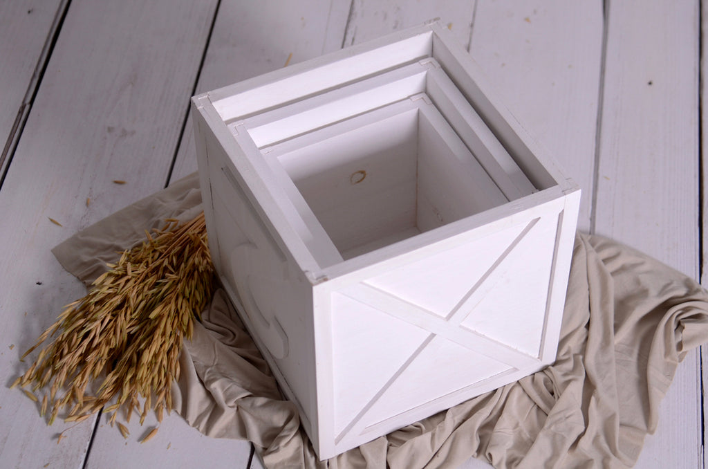 Open white nesting boxes with number detail, versatile newborn photography prop for milestone shoots.