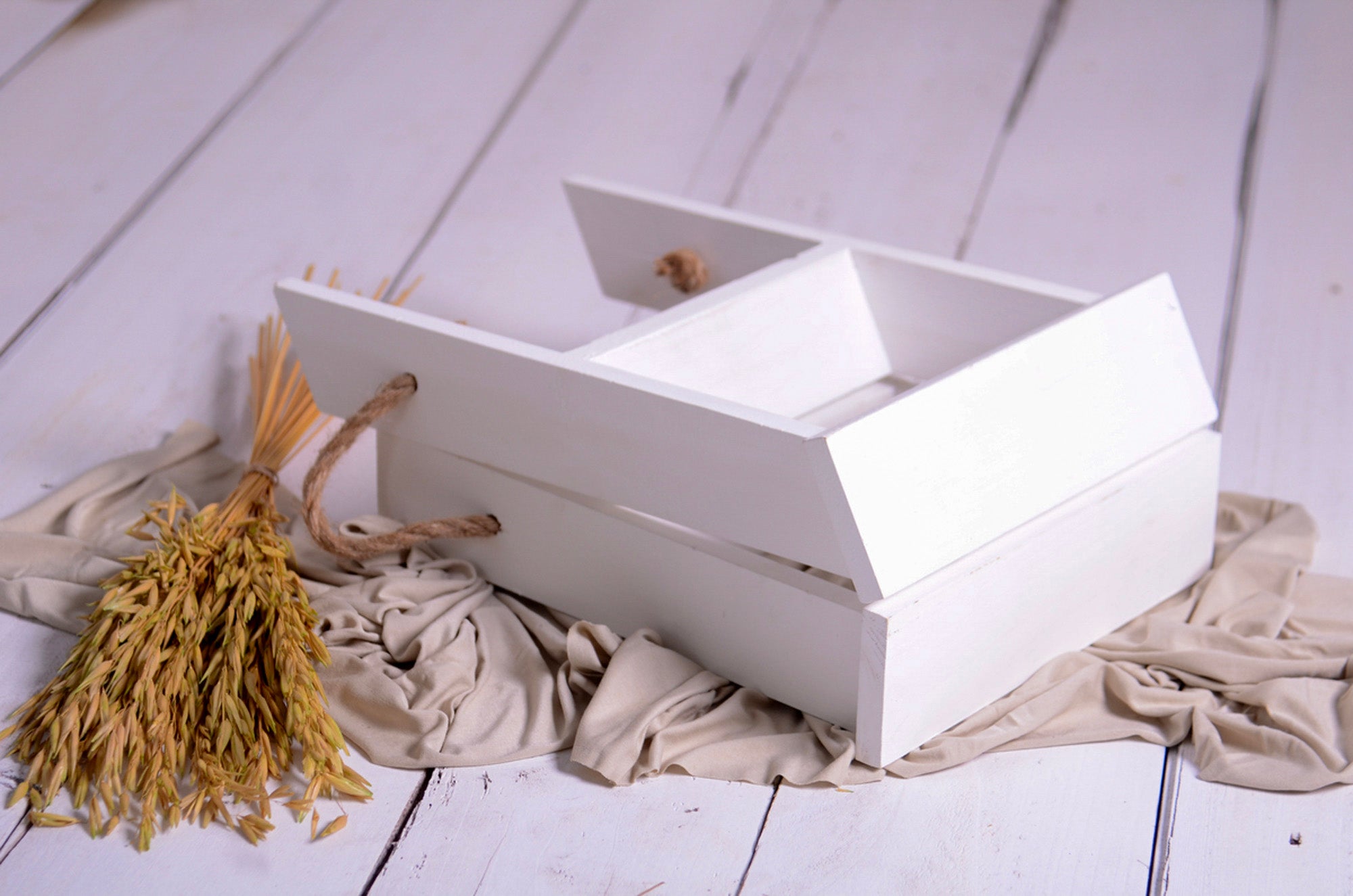 Mini step ladder prop laid flat on fabric, styled for cakesmash and milestone photo session setups.