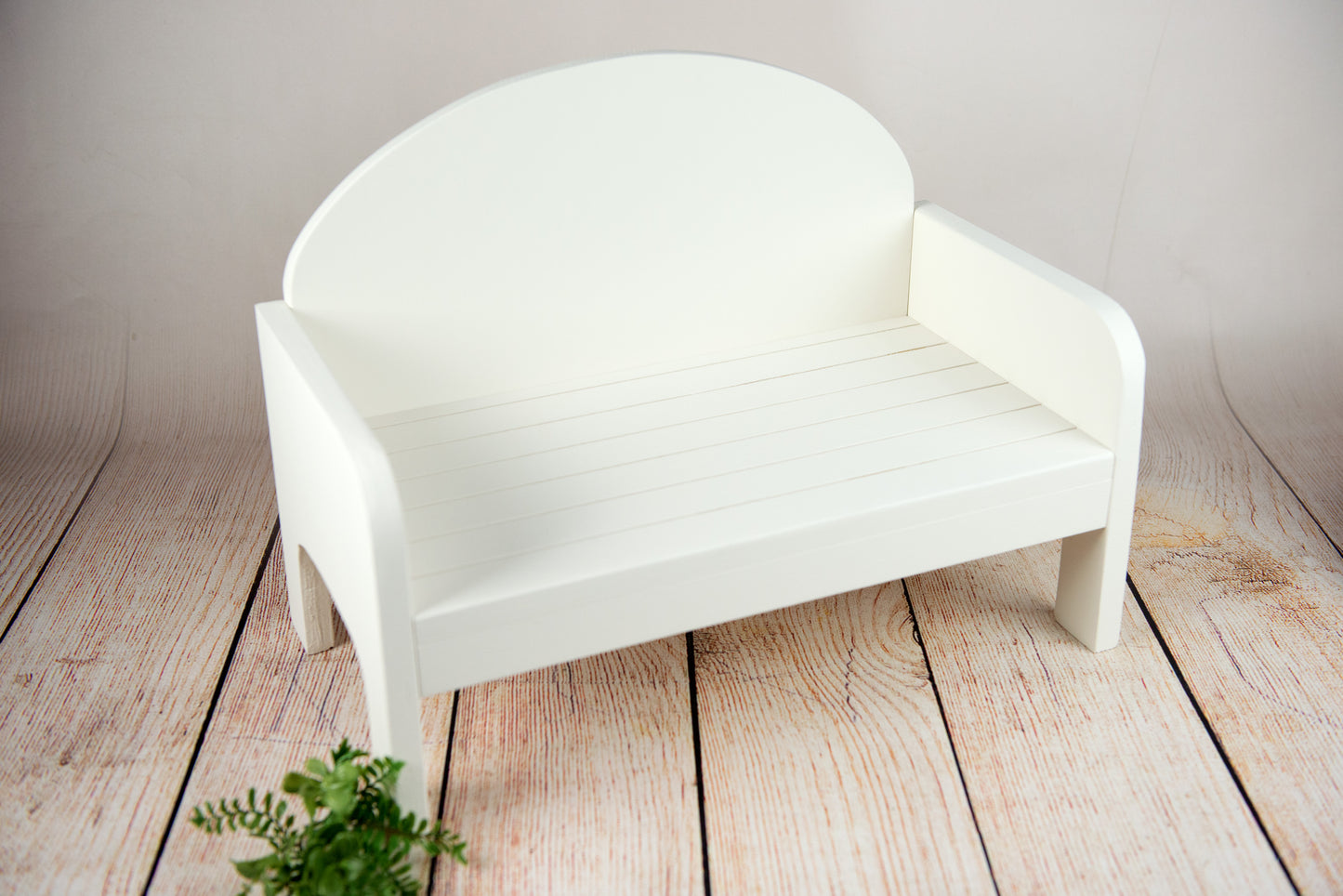 Handmade white rustic wooden bench for newborn photography, cozy curve design, ideal for newborn photographers