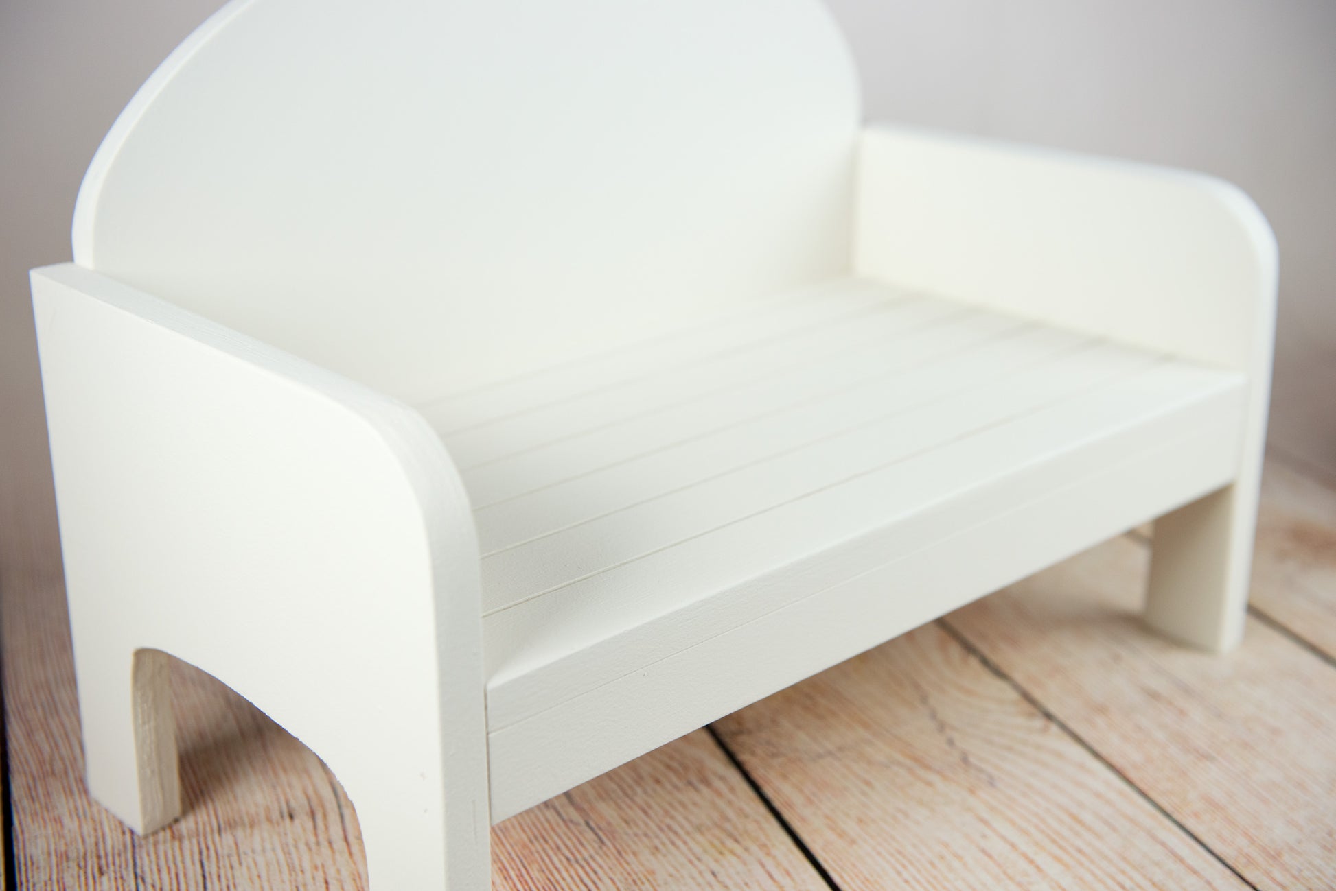 Handmade white rustic wooden bench for newborn photography, cozy curve design, ideal for newborn and baby photographers