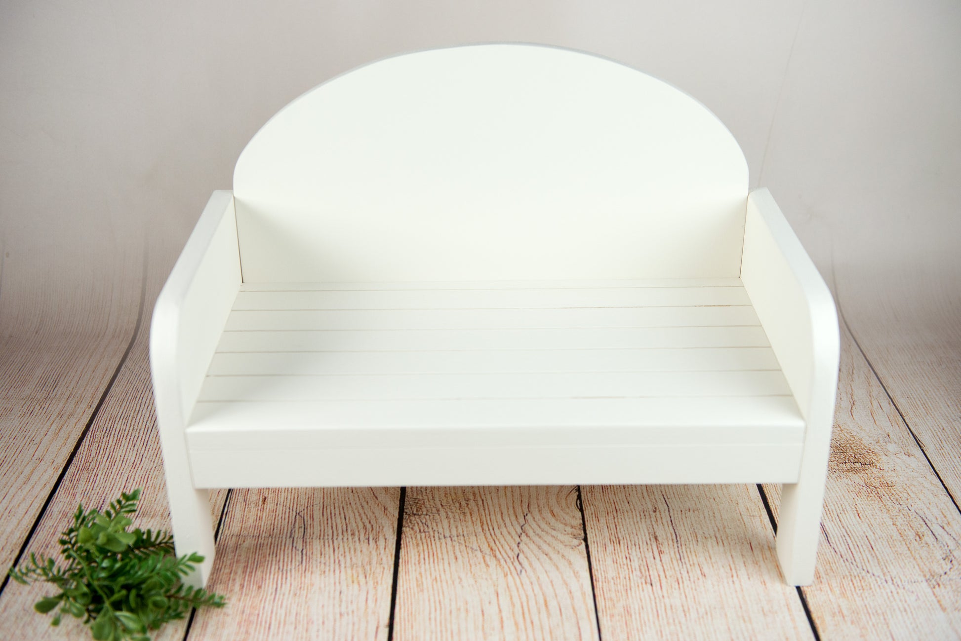 Handmade white rustic wooden bench for newborn photography, cozy curve design, ideal for baby photographers