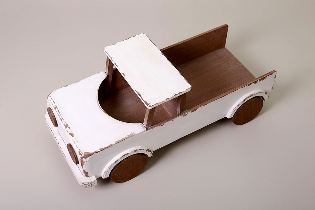 Top front view of a rustic wooden pickup truck with a distressed white finish, used as a baby photography prop for milestone sessions. Large pickup bed for posing.