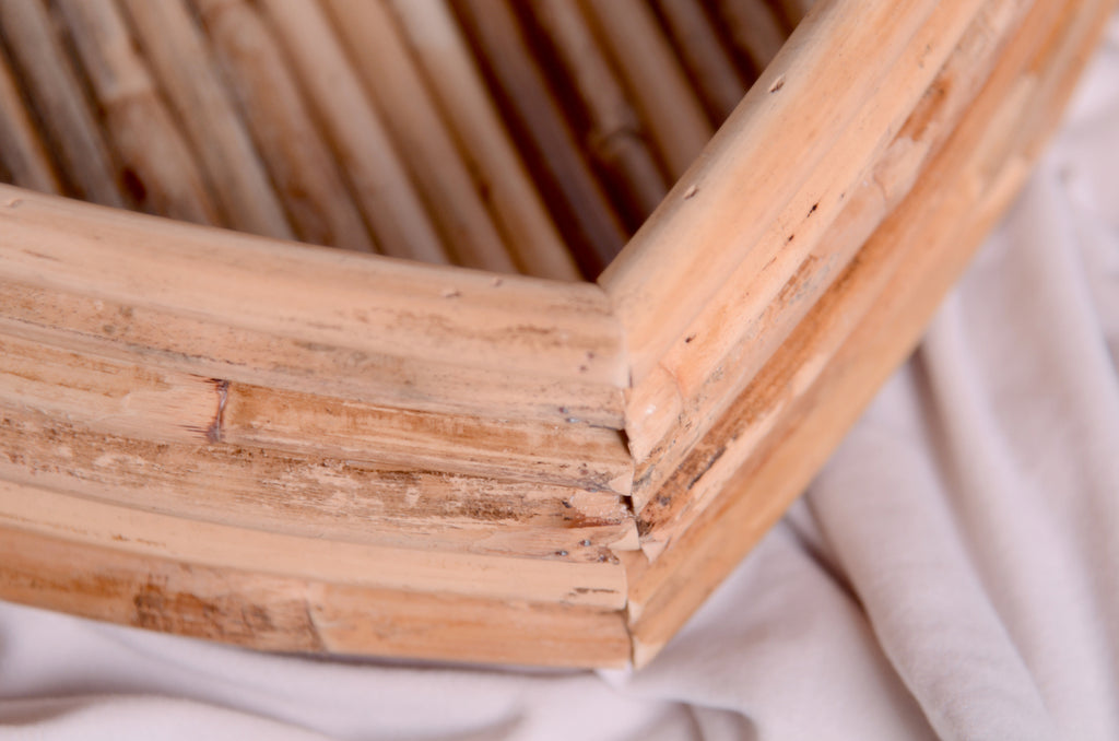 Close-up of the Rattan Heart Bowl’s intricate rattan weaving, showcasing its natural wood texture and handcrafted details—ideal as a newborn photography prop.