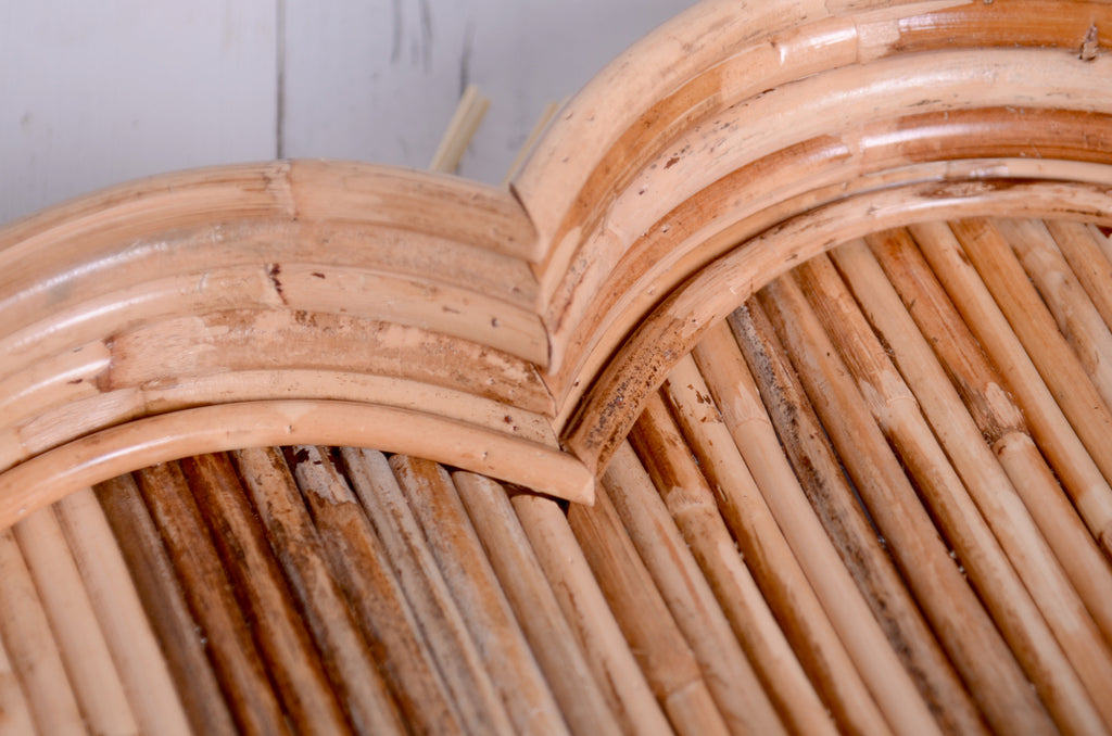 Side view of the Rattan Heart Bowl, highlighting its curved heart shape and sturdy design, perfect for capturing adorable newborn moments.