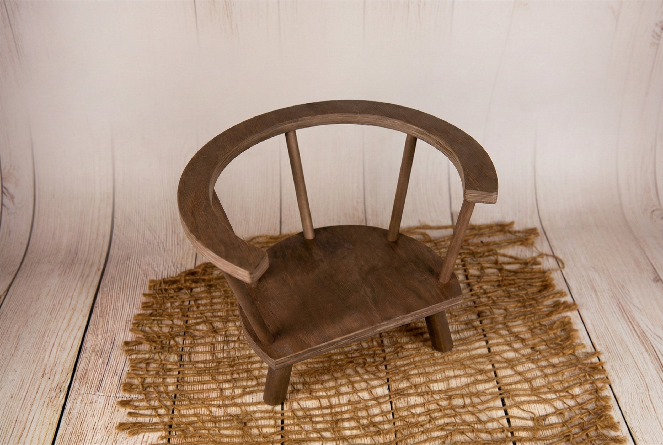 Wooden round orbit chair props for newborn photographers, top view.