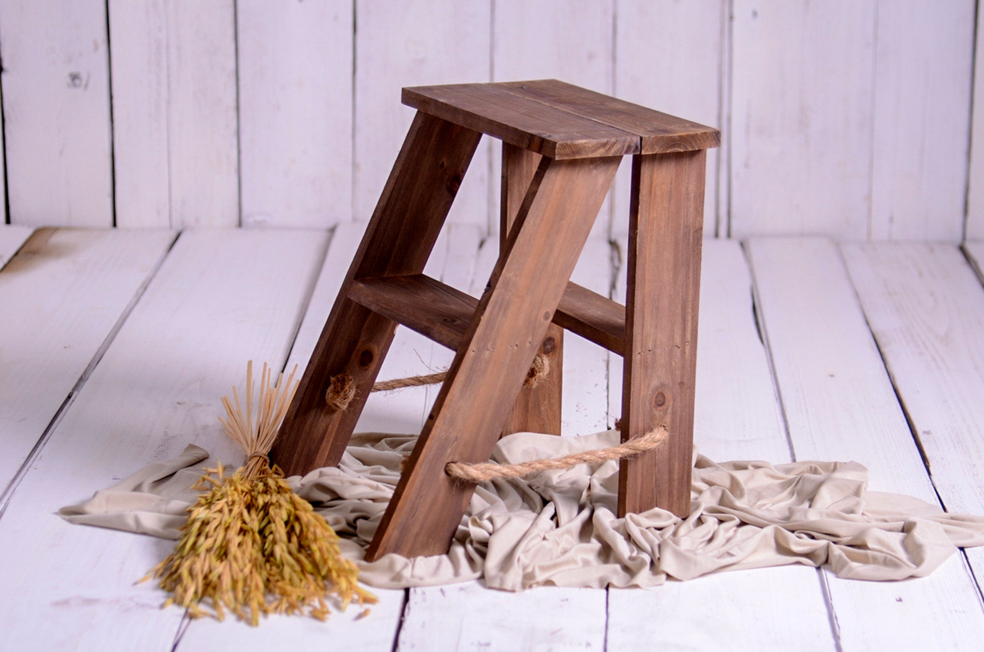 Rustic wooden step ladder mini prop with rope accents, ideal for cakesmash and milestone sessions.