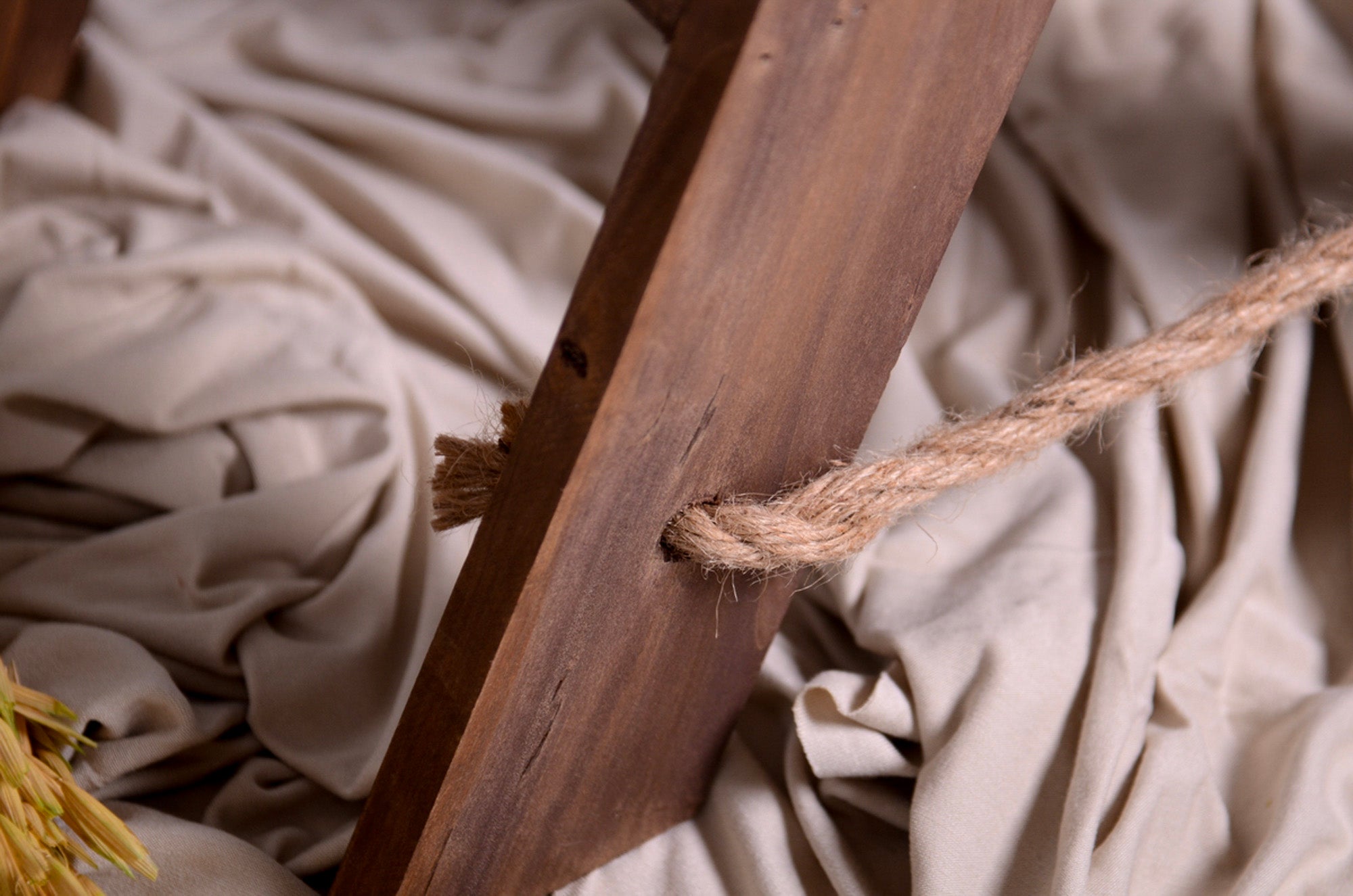 Close-up of jute rope detail on wooden ladder mini prop for cakesmash and milestone photography.