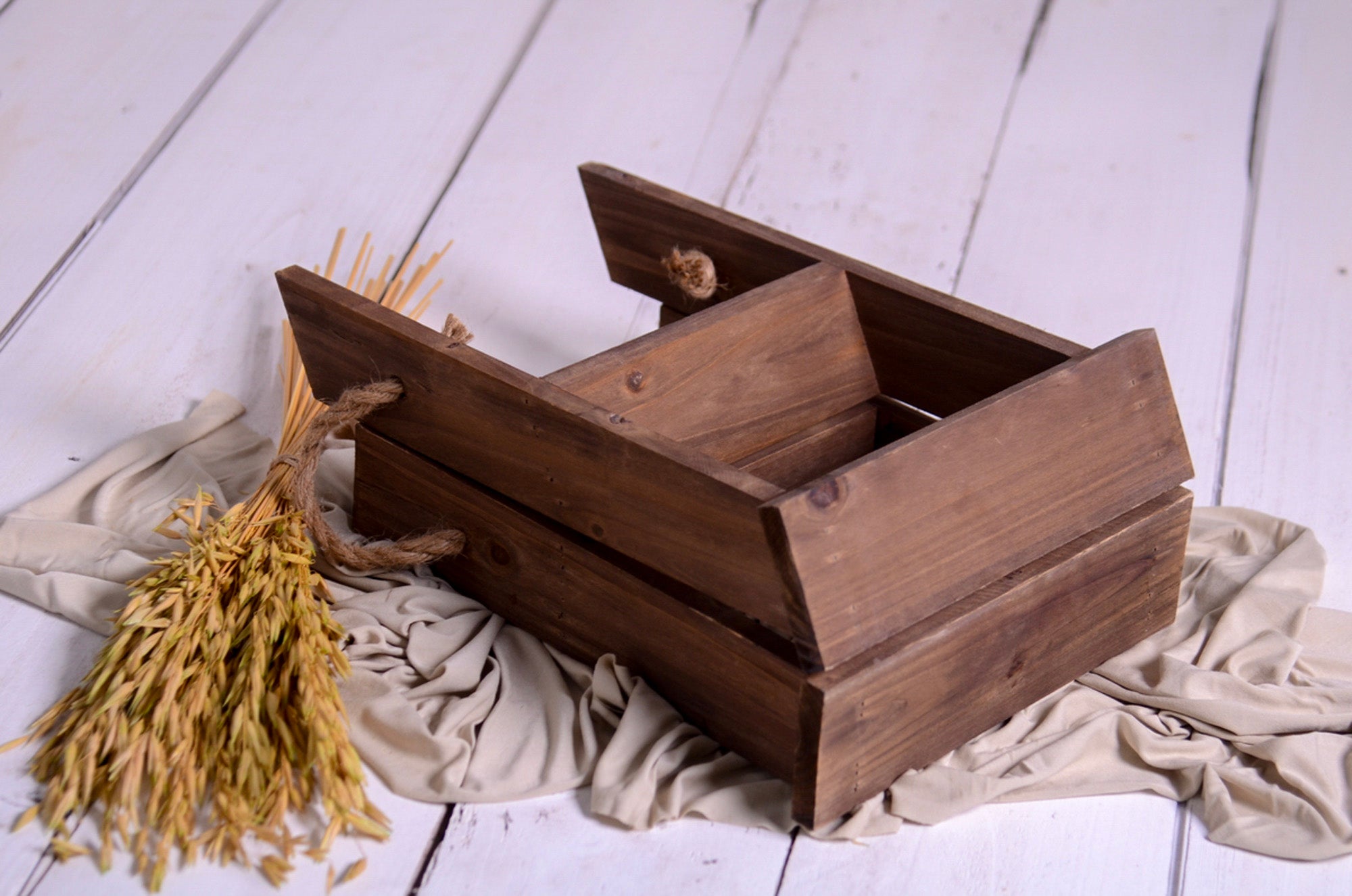 Wooden step ladder mini shown folded, styled with wheat and fabric for milestone and cakesmash setups.