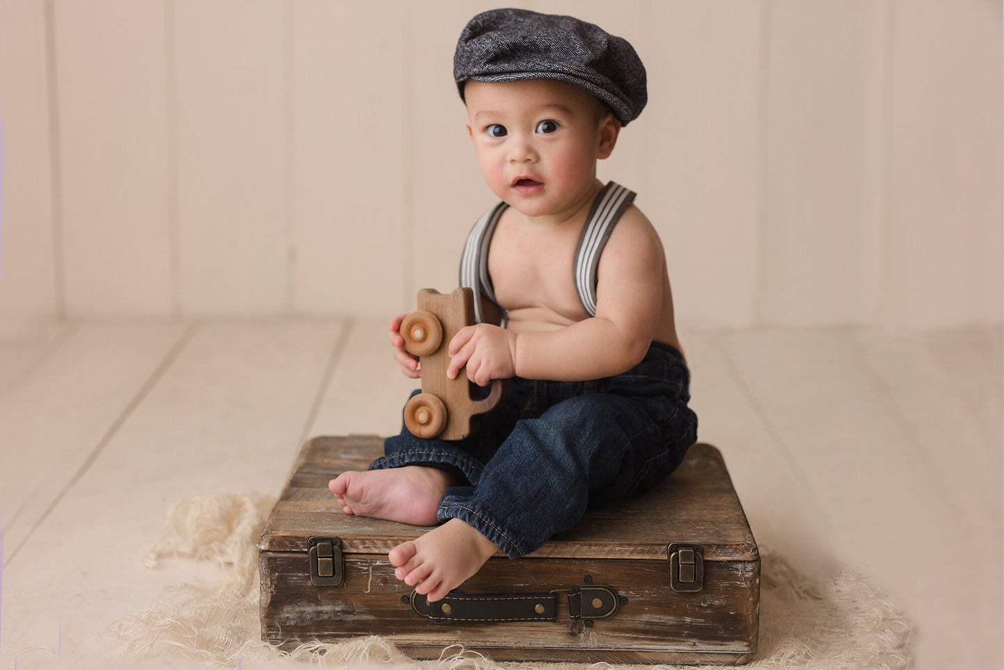 Rustic dark wood suitcase prop for newborn photography with distressed finish, perfect for vintage-inspired photoshoots at Newborn Studio Props