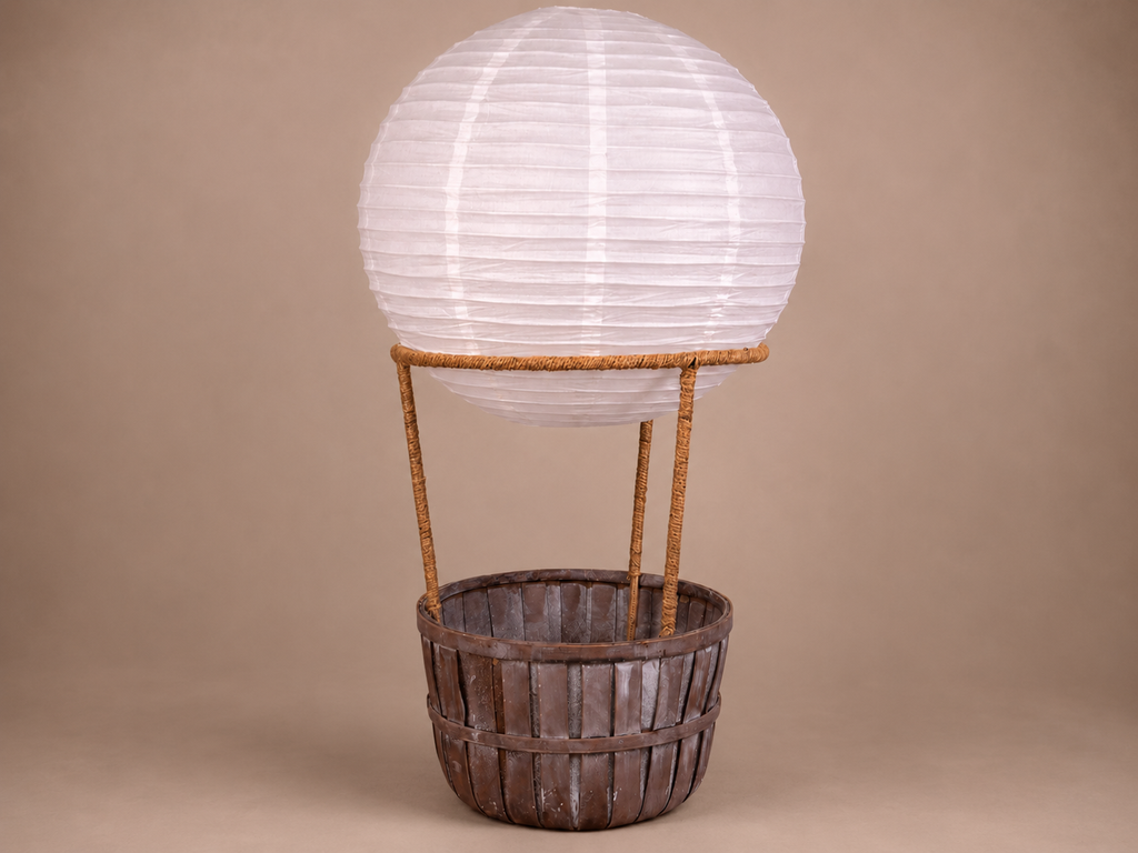 Decorative lantern shaped like a hot air balloon with wooden basket