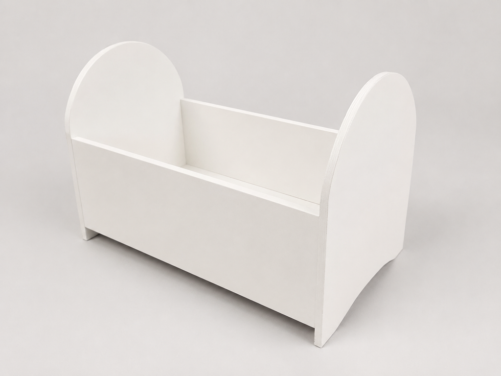 White baby crib on a light gray background