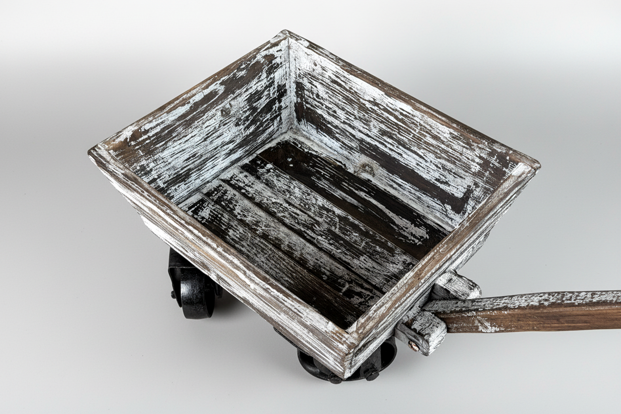 Top-down view of a rustic wooden wagon cart with distressed white paint, perfect as a newborn photography prop.