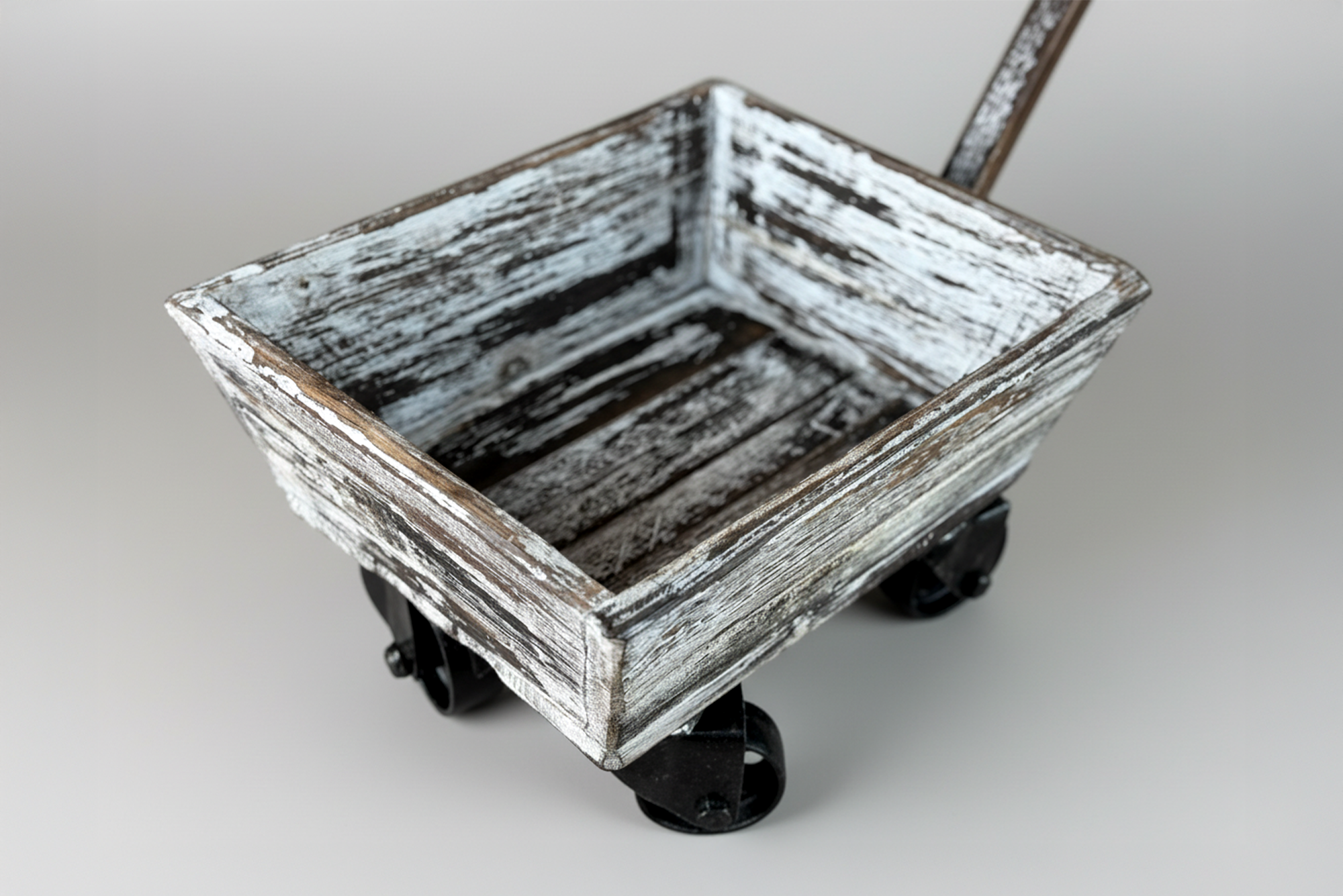 Angled side view of a weathered wooden wagon on metal wheels, ideal as a vintage newborn photography prop or fall theme photoshoot