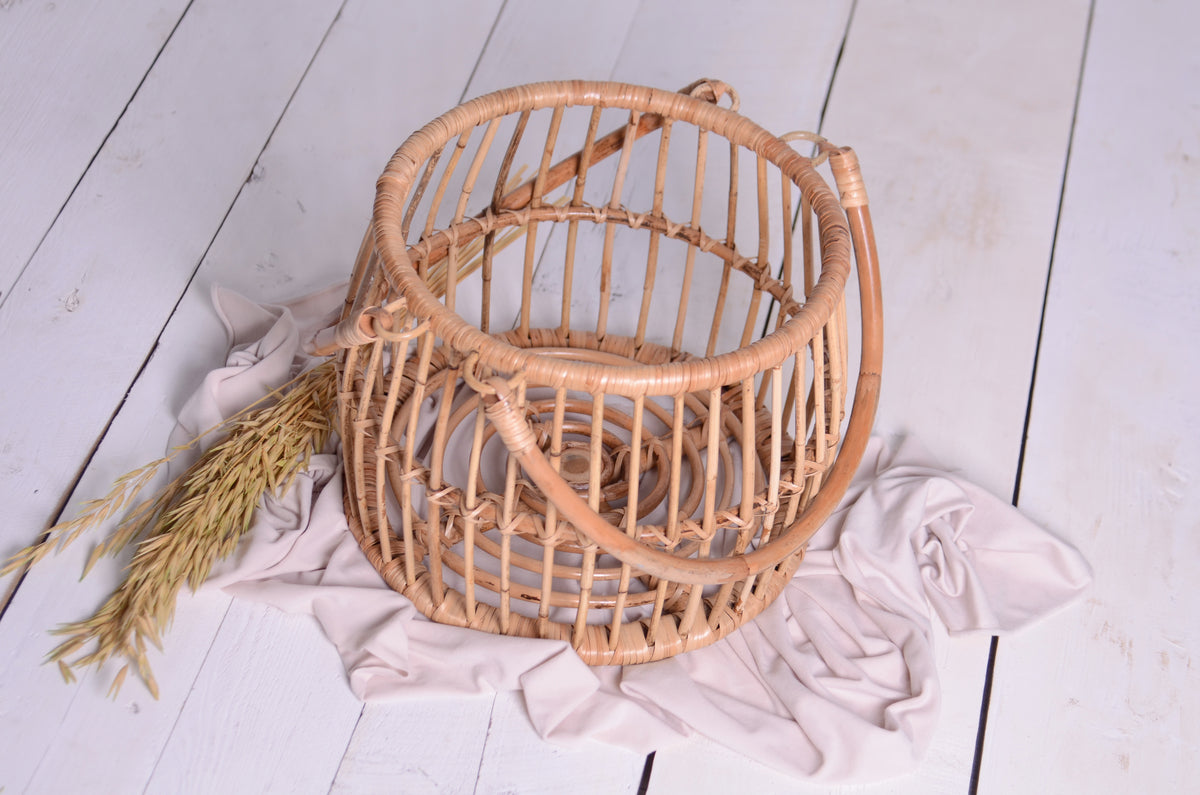 Boho Charm in Every Shot – A handcrafted rattan basket, perfect for newborn photography sessions. Styled with soft neutral fabric and delicate wheat accents for a warm, organic feel.