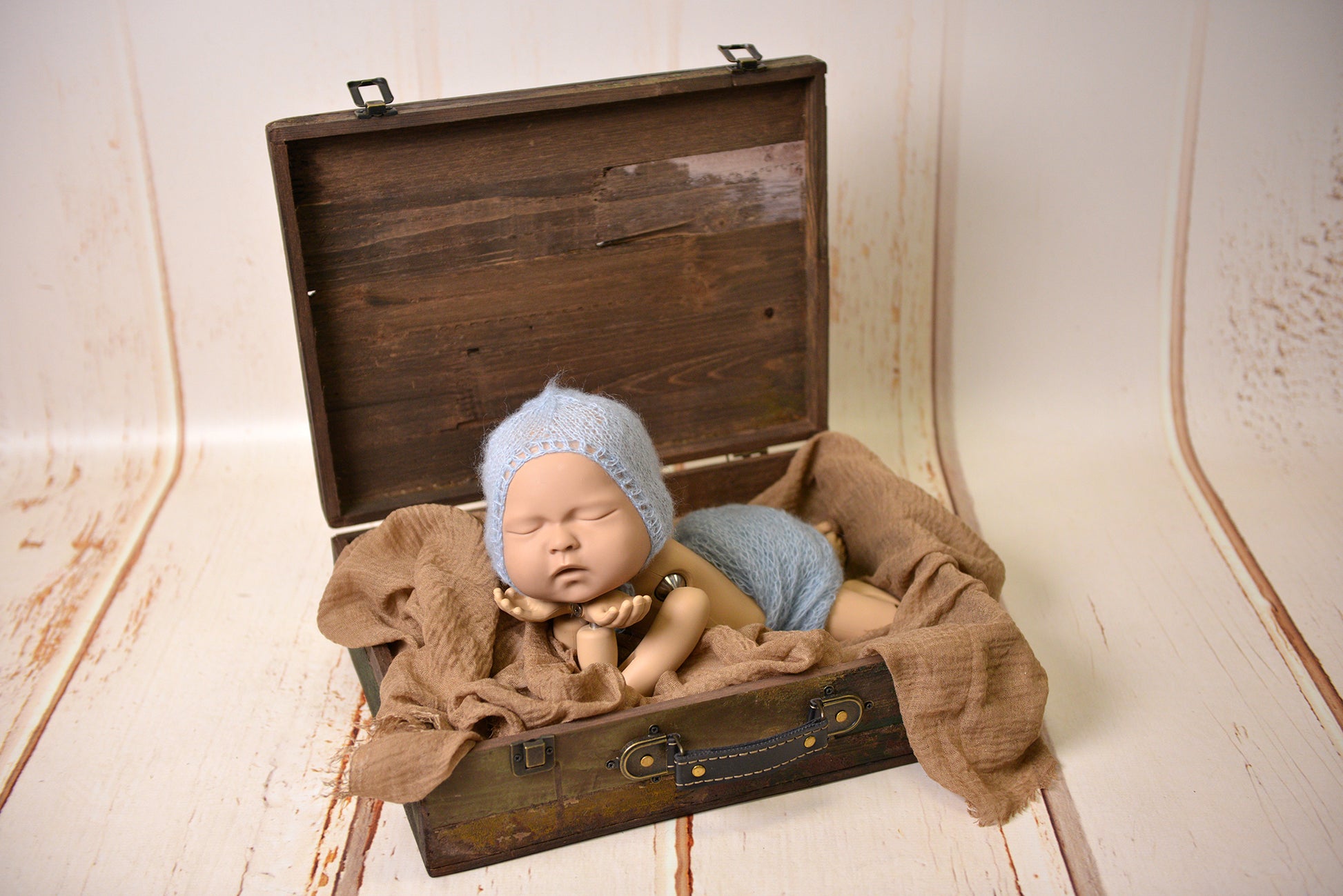 Rustic reclaimed dark wood suitcase with distressed finish and faux leather handle for charming newborn photography, perfect baby photo prop