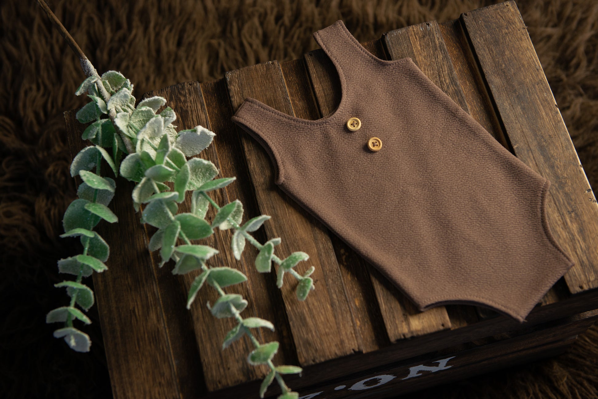 Lovely handmade sleeveless romper perfect for any newborn session. Made with our signature and best-selling textured fabric. Faux buttons come down the front to give the look an added bonus. Stretchy enough to fit newborns 0-14 days old. 