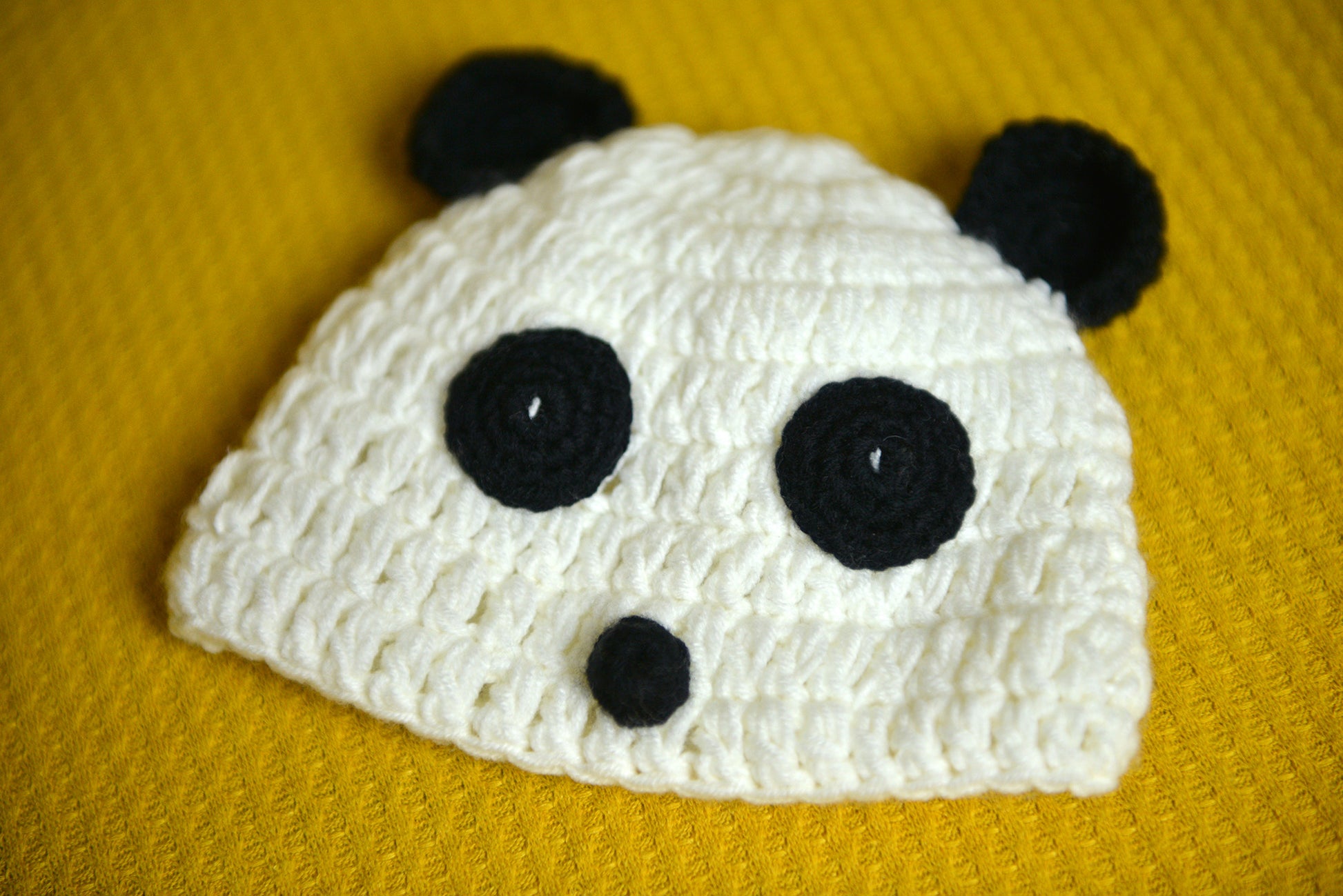 Crochet Panda hat for newborn photography session.