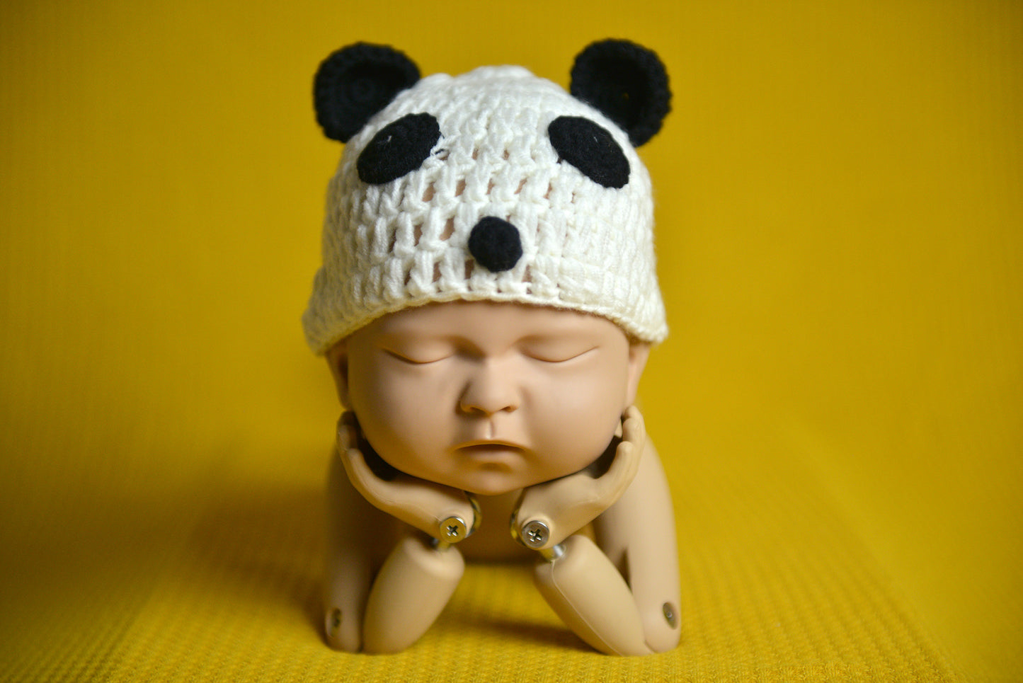 Crochet Panda hat for newborn photography session.