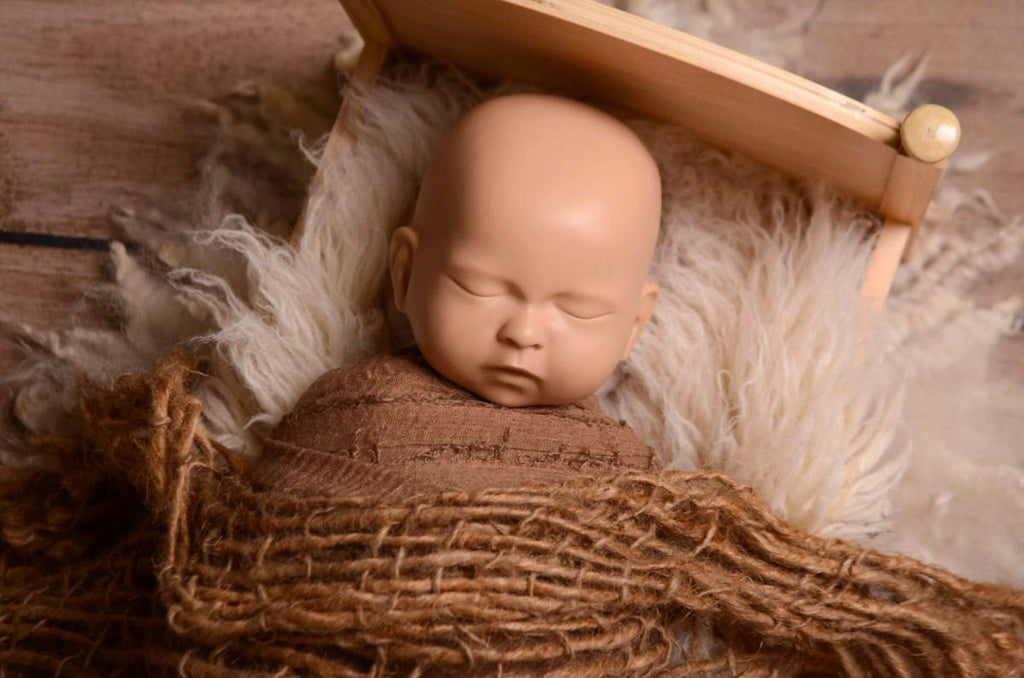 This incredible set of head support positioning pillows is one of the must-have items for every newborn photographer's studio.