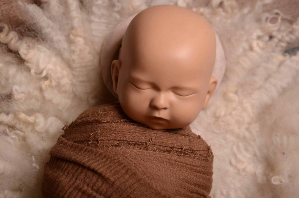 This incredible set of head support positioning pillows is one of the must-have items for every newborn photographer's studio.