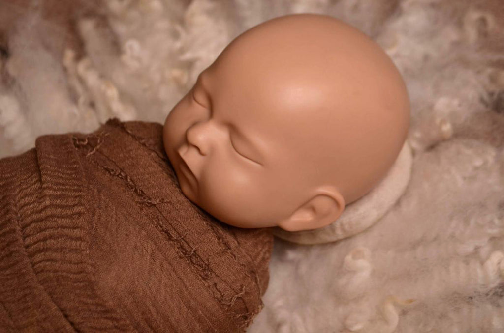 This incredible set of head support positioning pillows is one of the must-have items for every newborn photographer's studio.